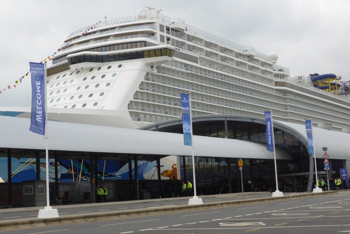 Flags on concrete bases at cruise ship entrance