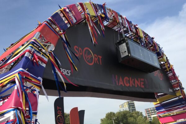 Truss welcome arch on concrete bases at the Hackney Half Marathon