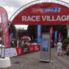 Truss welcome arch on concrete bases at the Clipper Round the World Race Village fanzone