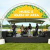 Truss welcome arch on concrete bases and stage
