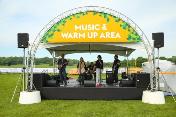 Truss welcome arch on concrete bases and stage