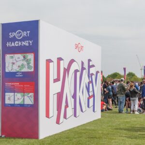 Large super-graphic wayfinding and photo backdrop at the Hackney Half Marathon