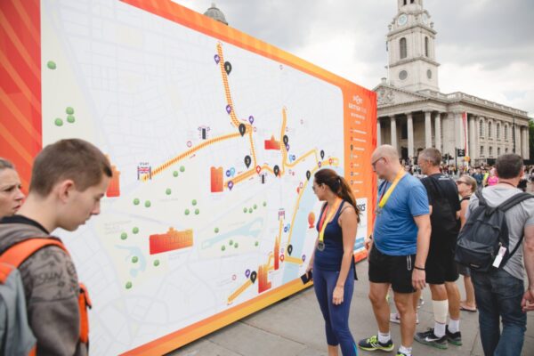 Large super-graphic wayfinding and photo backdrop at Half Marathon