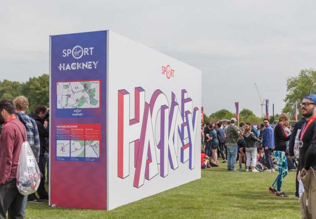 Large super-graphic wayfinding and photo backdrop at the Hackney Half Marathon