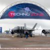 Truss arch on concrete bases at airshow